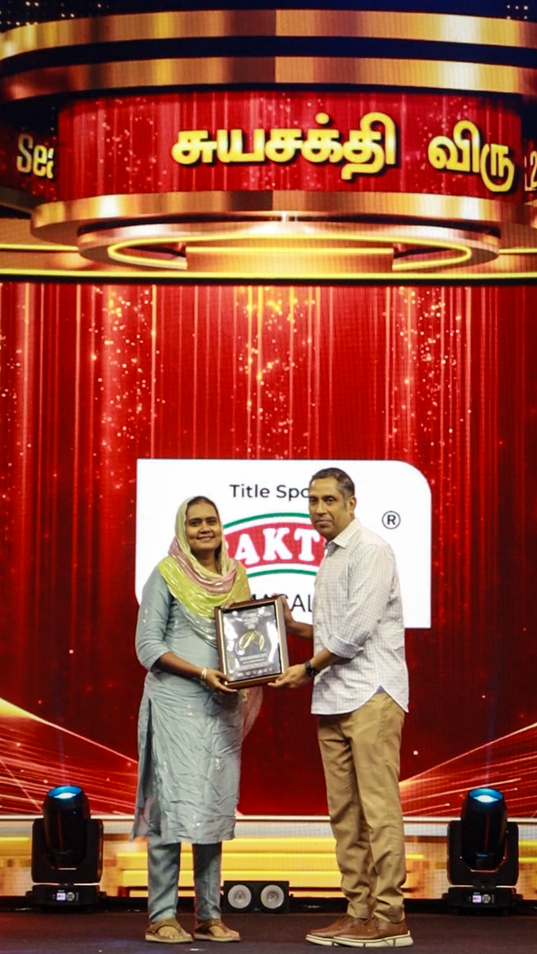 Aysha Nasreen receiving her award on stage at the Suyasakthi Homepreneur Awards 2026